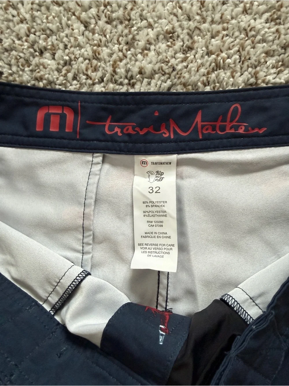 Travis Mathew Navy Swim Shorts with Red & White Liberty Icons